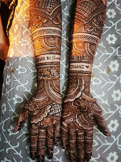Mehndi for the whole family! This design was for the bride's sister-in-law, with "Jethani" and "Devar ki Shaadi" beautifully written into the intricate patterns on her arms.
