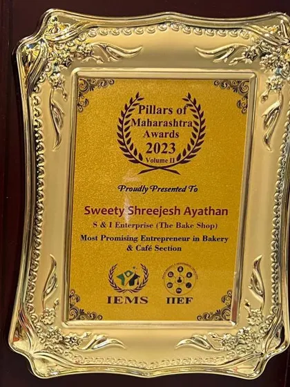 A close-up of the 'Most Promising Entrepreneur in Bakery & Café Section' award presented to our Panvel Franchise.