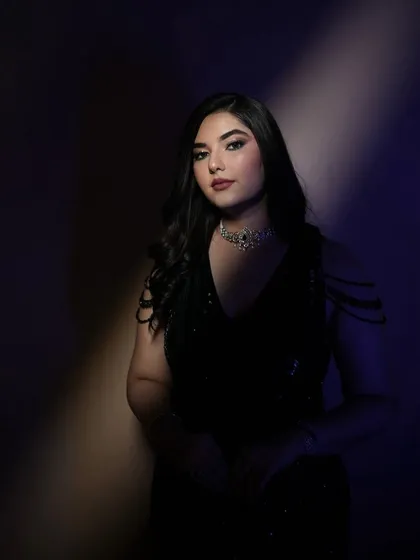 Another moody, artistic shot that focuses on the bride's serene expression. The makeup looks beautiful even in low light, a testament to using the right products and techniques.