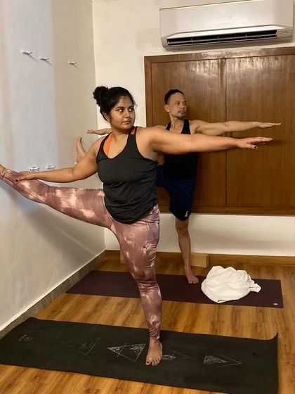 Using the wall for support in Utthita Hasta Padangusthasana allows for a deeper, more stable hamstring stretch.