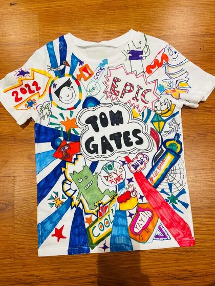For the ultimate fan! I hand-illustrated this epic Tom Gates doodle t-shirt for a 9-year-old's birthday. I love taking a child's favorite character and creating a piece of wearable art just for them.