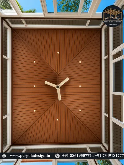 A perfect fusion of form and function. This view from above highlights the sophisticated pyramid ceiling design with a central wooden panel and surrounding glass skylights, flooding the room with controlled natural light.