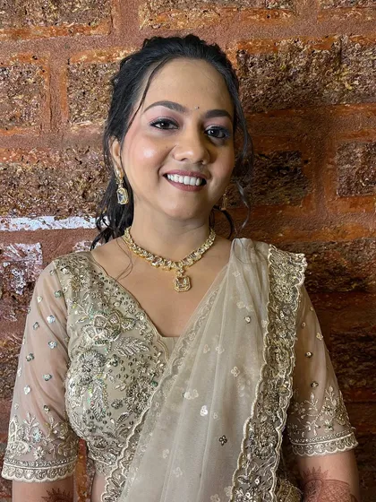 A happy, smiling bride, ready for her sangeet night.