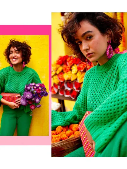 A monochromatic green look from the campaign. Styling a chunky knit sweater with matching pants creates a strong color story that makes the pink accessories stand out beautifully.