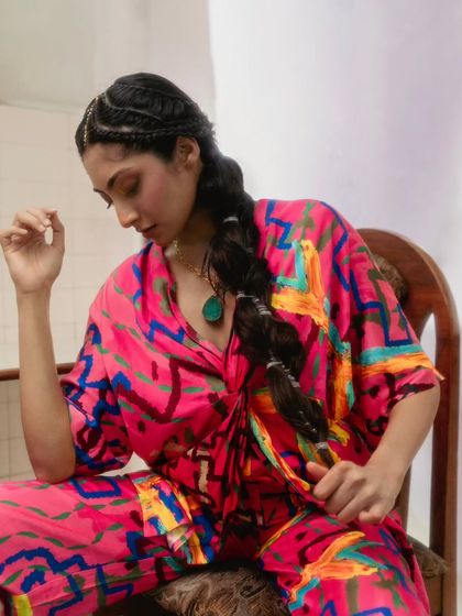 A quiet, contemplative moment captured during the Advait shoot. The focus here is on the texture of the fabric and the beautiful way the colors blend together, showing the versatility of the resort wear collection.