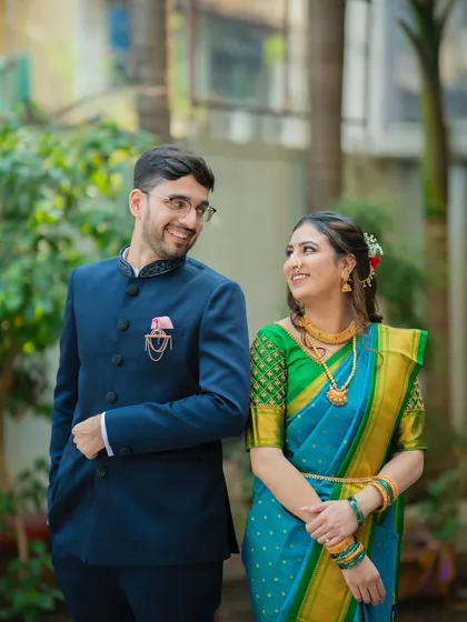 A candid moment where Ameya and Gautami share a look. These natural interactions are what bring a photo gallery to life.