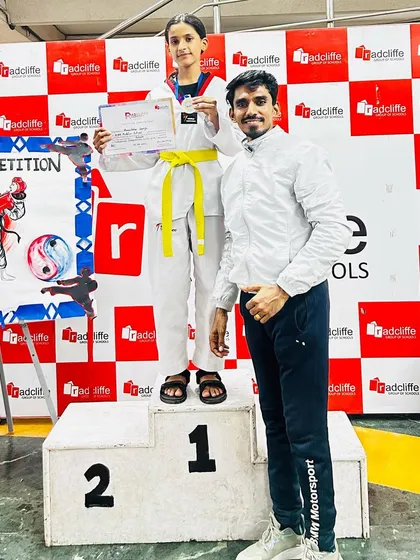 A proud moment on the victory podium at the Radcliffe School competition.