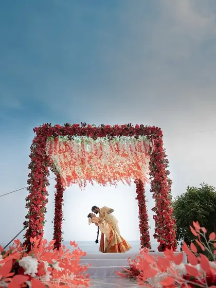 A breathtaking wide-angle shot of a couple under their floral mandap at a destination wedding in Cintacor. I use compositions like this to frame your love story against the grandeur of the location.