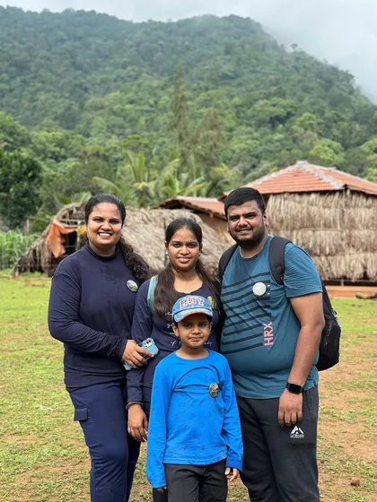 A family poses at the homestay, ready for their Kodachadri adventure.