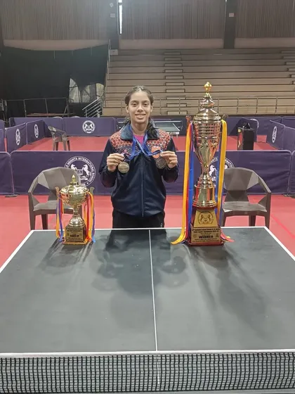 A powerful image of Ananya Chande with her impressive trophies from the SGFI games. This showcases the rewards of dedication and high-performance training for school-level national competitions.