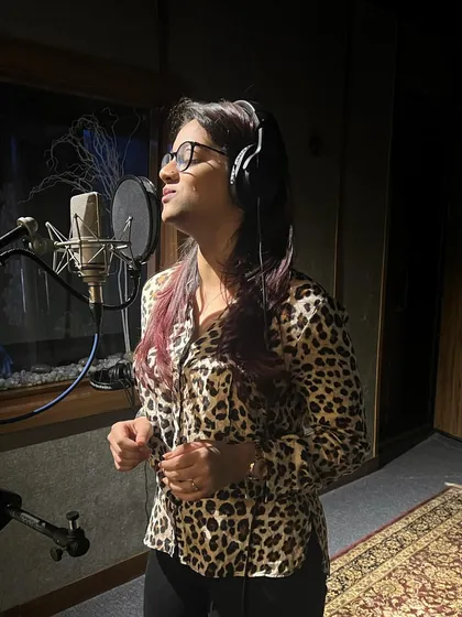 A quiet moment of focus during a recording session. When you hire me, you get a dedicated artist who will pour all her energy into making your track sound exactly the way you envision it.