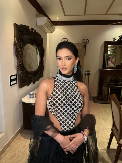A close-up on the clean makeup and sleek hair that complete this contemporary look.
