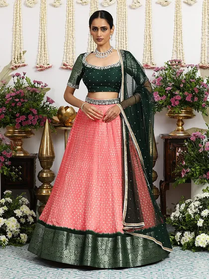 The same coral and green lehenga, showcasing its beauty and versatility.