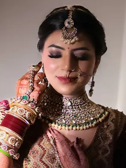 A close up of my regal bride's makeup. The smokey eye and nude lip combination is perfect for a heavy velvet lehenga and polki jewelry.