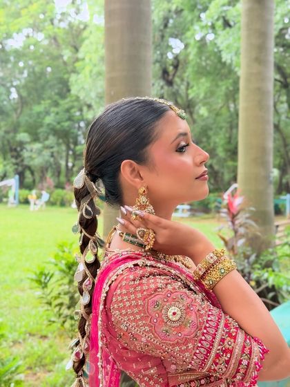 A detailed shot of the intricate mirror-work braid. I love collaborating with hairstylists to create a complete, cohesive look for my brides.