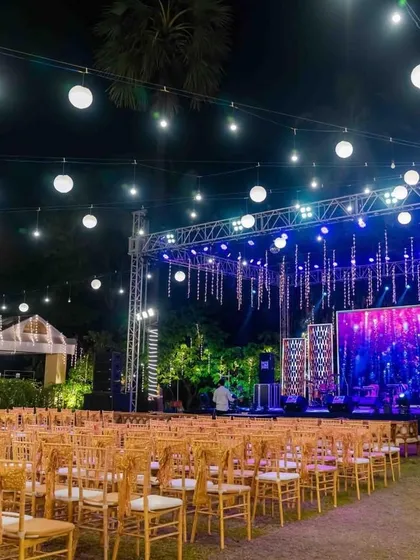 A full view of a concert-style stage setup for a Sangeet night. Complete with a large LED screen, professional trussing, and lighting, this is for couples who want a truly epic party.