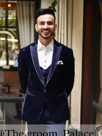 A happy client looking dapper in our semi-embroidered blue velvet tuxedo. This three-piece set is perfect for a cocktail party or reception, offering a rich texture and a sharp, modern silhouette.