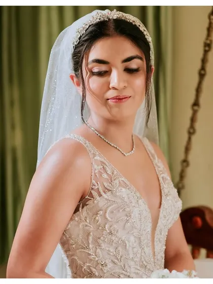 A close-up of Anthiya's church wedding makeup. The look featured soft lilac undertones on the eyes, no false lashes, and an incredible glow, keeping it sophisticated and elegant.