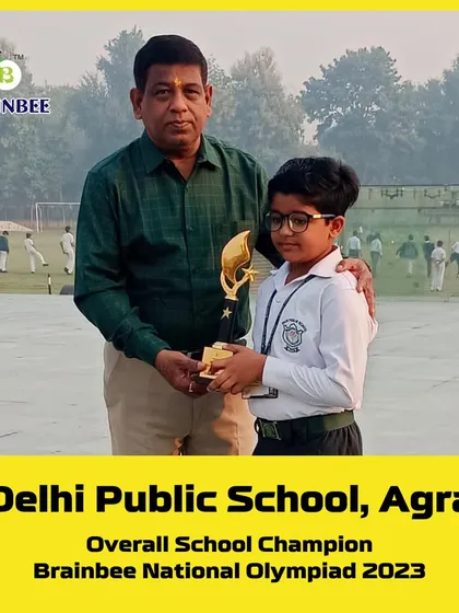 Another proud trophy winner from DPS Agra, celebrating his achievement in the 2023 National Olympiad.