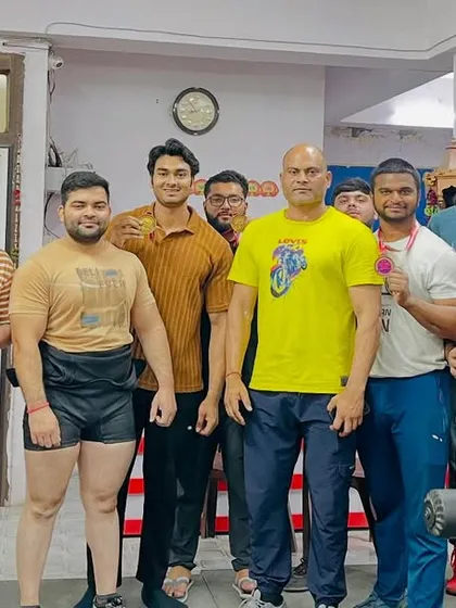 The team at Powerlifting Studio after a successful competition. The medals and trophies are proof of their dedication and our collective effort.