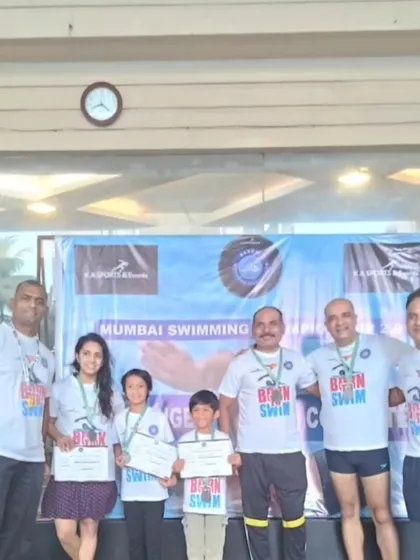 Our family of swimmers, both young and old, celebrating together. Swimming is a sport that bridges generations, and our team reflects that diversity and shared passion.