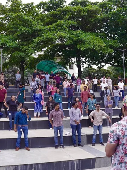 A wide shot of the participants at the outdoor wellness event. It’s inspiring to see so many people committed to their health and having a great time doing it.