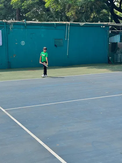 A young player stands ready on the court during the Inter School Tennis Tournament 2024 at Bombay Gymkhana.