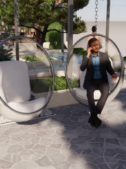 Modern bubble swing chairs offer a playful and stylish seating option in this outdoor lounge area. Placed on a stone patio near a water feature, they create a relaxing spot for conversation and enjoying the garden view.