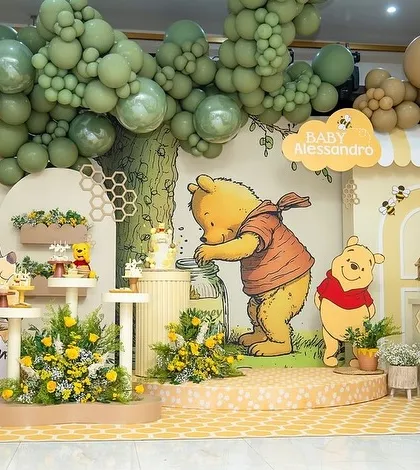 Another view of the Winnie the Pooh baby shower stage, showing the full setup with "BABY" blocks.