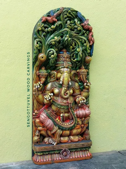 Another angle of the 36-inch multi-colored Ganesha jolly panel. This view shows the depth of the carving and the way the colors enhance the three-dimensional effect of the lattice work.