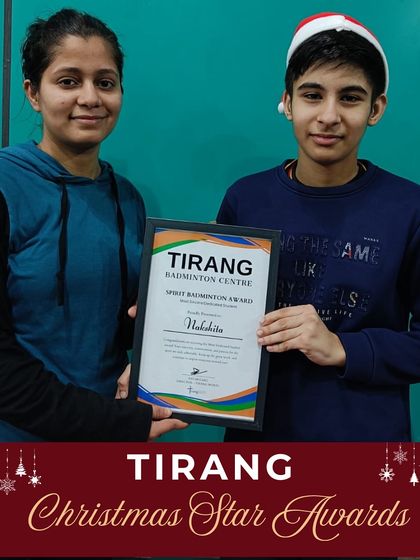 A coach presents the "Spirit Badminton Award" to a student for her sincerity and dedication. These values are what truly shape a player's character on and off the court.