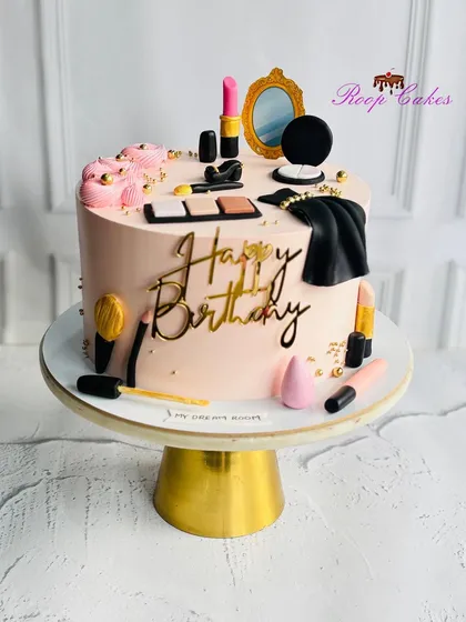 A cake straight out of a glam girl’s dream. This 'My Dream Room' themed birthday cake features edible makeup, brushes, and a mirror.
