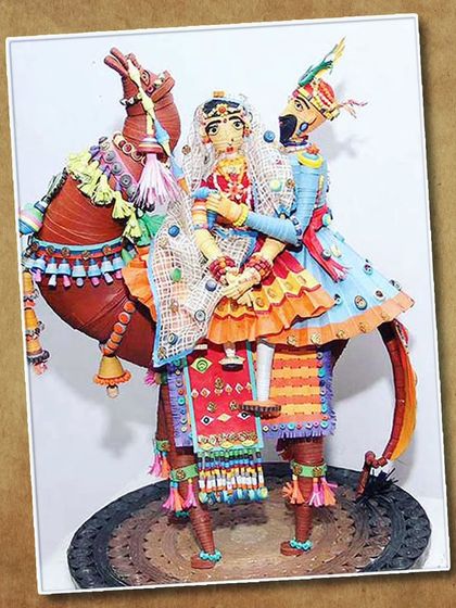 Another view of the award-winning Rajasthani couple quilling art, showcasing the intricate details and vibrant colors.