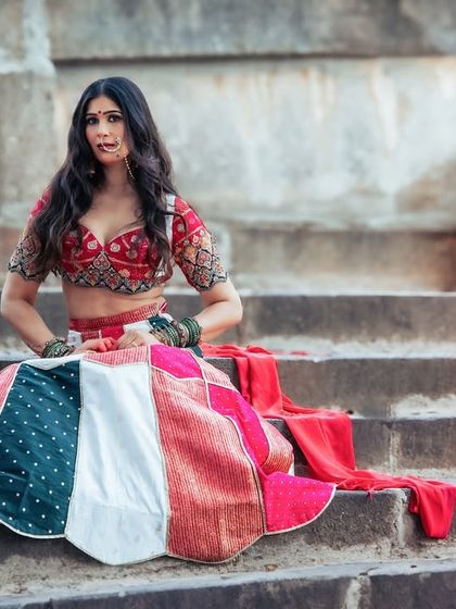 A powerful and confident seated pose. Her direct gaze and strong posture command attention, telling a story of a modern queen on her throne.