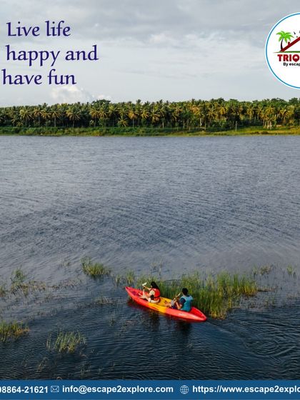 Live life, be happy, and have fun. An aerial shot of a couple kayaking in a quiet part of the lake.