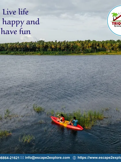 Live life, be happy, and have fun. An aerial shot of a couple kayaking in a quiet part of the lake.