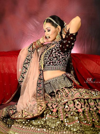 A dynamic pose that shows off the bride's attitude and the beautiful flare of her embroidered lehenga.