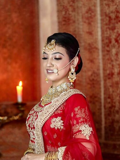 A smiling bride, looking radiant and happy. The makeup is designed to look joyful and fresh, with soft golden eyes and a natural lip color that enhances her beauty without feeling heavy.