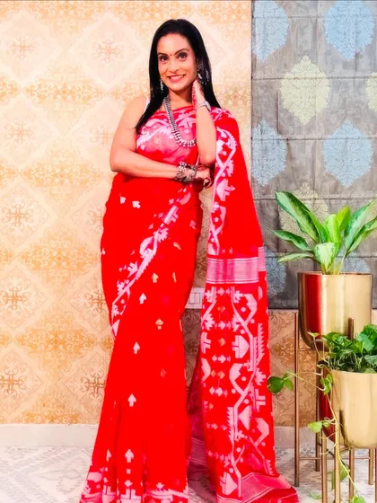 A stunning red Jamdani saree with intricate white weaving. This is a bold and beautiful saree that is sure to get you compliments.