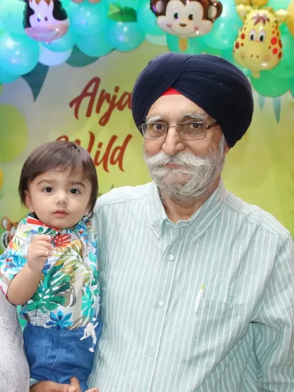 A grandfather and his grandson at a jungle-themed birthday party. I love taking photos that show the bond between different generations.