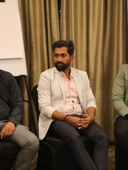 Our team members listening intently during the panel discussion. We are always eager to learn from and share with fellow industry experts.