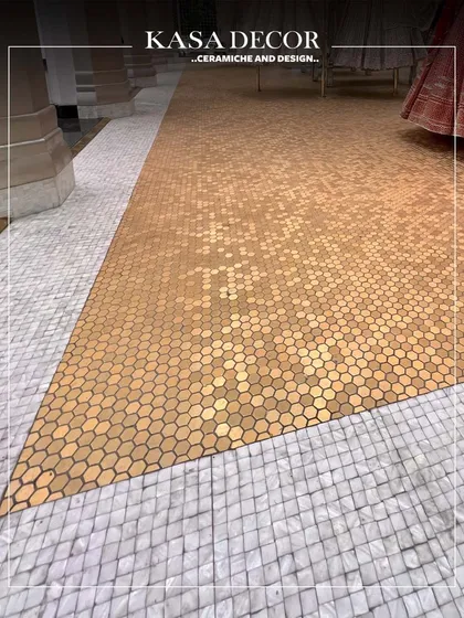 The details are everything. This floor for the Seema Gujral flagship store combines the warmth of golden hexagonal mosaics with the subtle shimmer of mother of pearl. This intricate inlay work is designed to guide the eye and create a journey through the space.