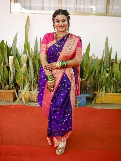 A full-length shot showcasing the elegant drape of the navvari saree. I take care of the draping to ensure it's perfect for your big day.