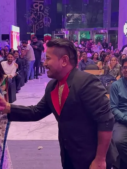 Walking through the audience is a great way to make a large show feel personal. I brought the magic right to this guest's seat at a corporate Diwali party, giving her a front row experience.