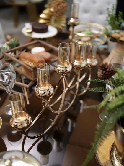 The Vesper Quintet styled on a lavish grazing table. Its warm candlelight adds to the inviting ambiance, proving it’s a perfect addition to any celebration.