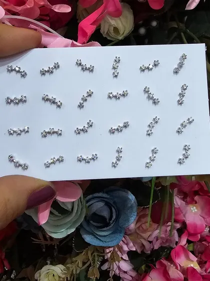 A collection of our curved bar and star cluster studs, perfect for creating a modern and celestial-themed ear stack.