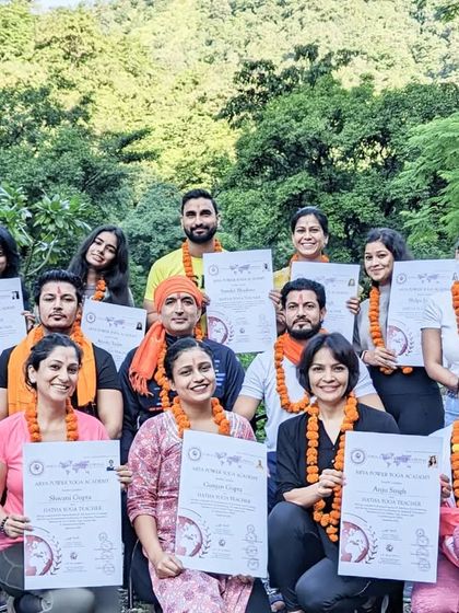 A proud moment for our graduates, holding their hard-earned certificates after completing the rigorous 300-hour YTTC.