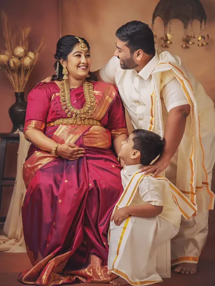A complete family portrait filled with so much joy. Dressed in coordinated traditional outfits, this family’s love and excitement for their new arrival shines brightly.