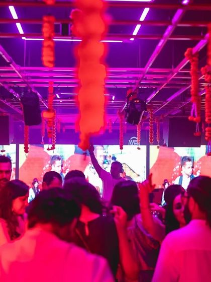 The view from the back of the dance floor at Gawky Goose, with festive decorations and a great crowd enjoying the music.