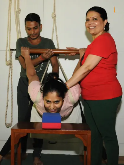 Here, you see the essence of my therapeutic work. With the support of props and my trained assistants, this student is able to achieve a deep, supported backbend that would be impossible otherwise. This precision allows us to work on deep-seated stiffness and emotional blockages safely, restructuring the body and mind.